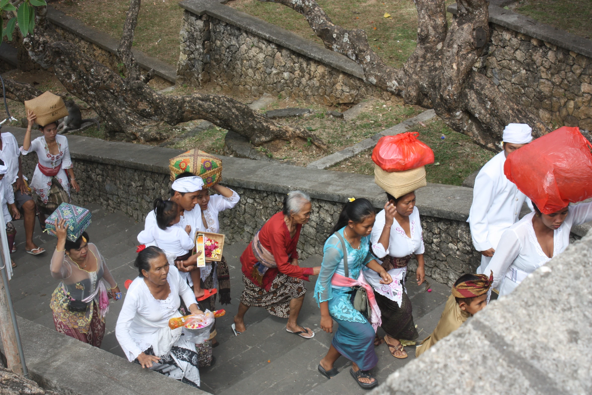 many people are sitting down on the steps together