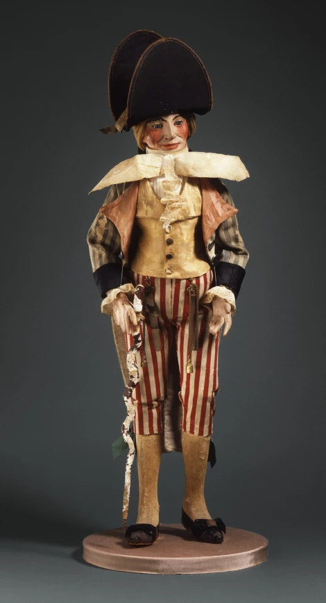 a life size figurine of a boy in a pirate costume