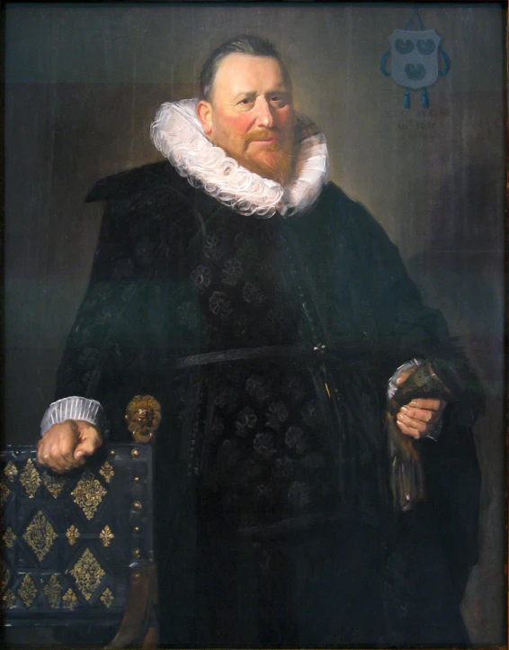 a man holding a black briefcase by a painting