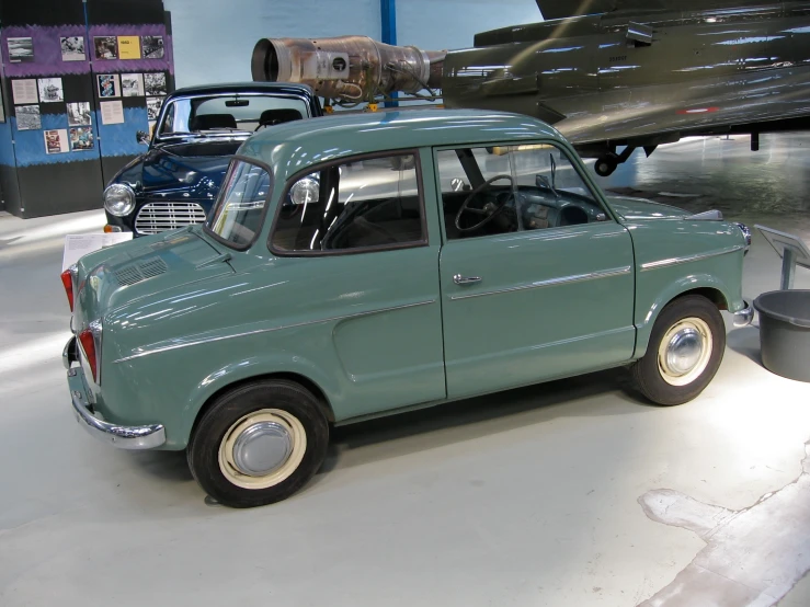 this is an old fashion car displayed in a museum