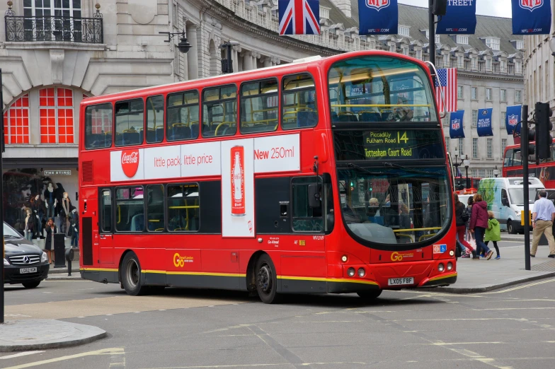 the double deck bus has stopped on the side of the road