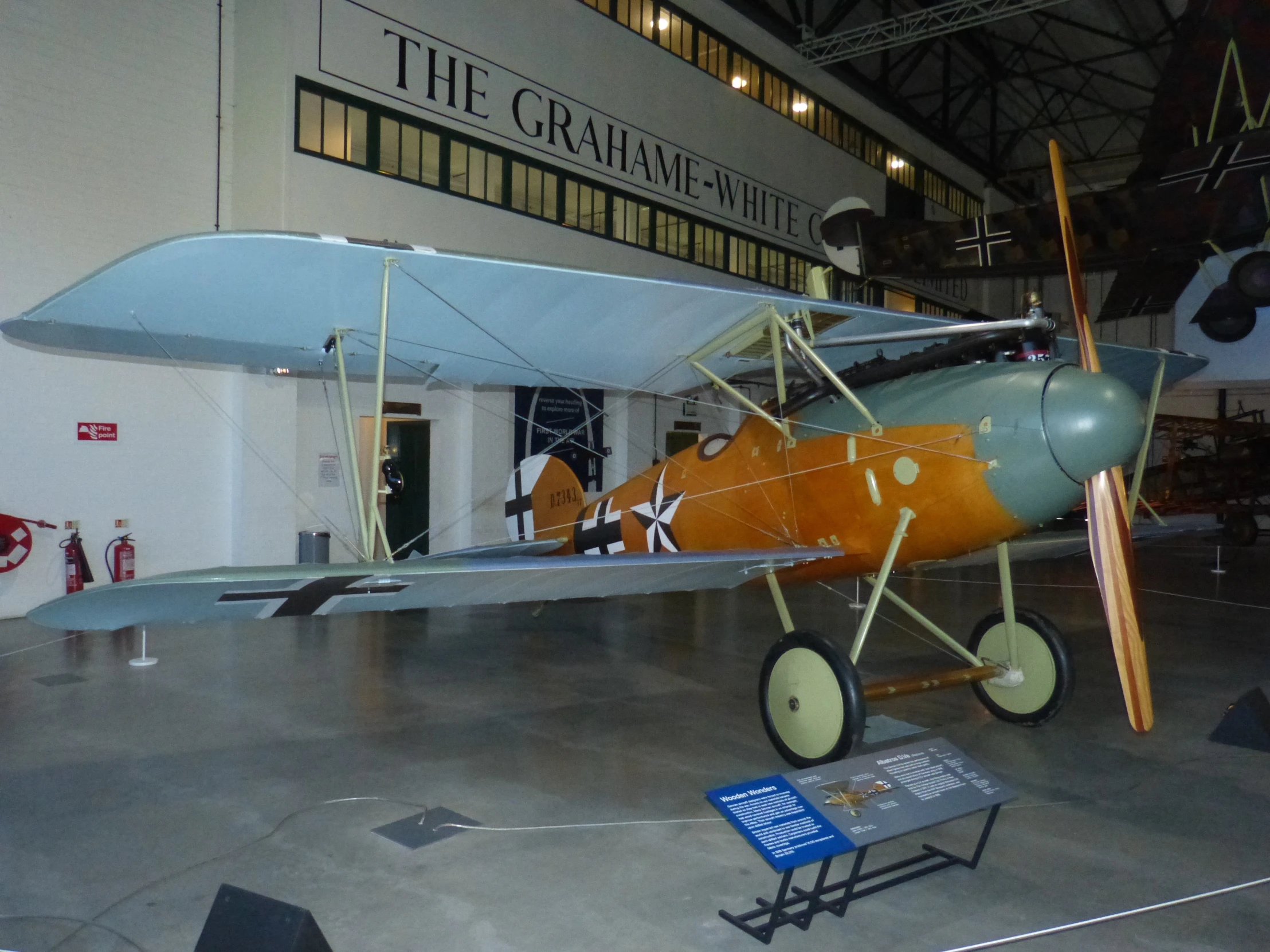 an old plane on display inside of a building