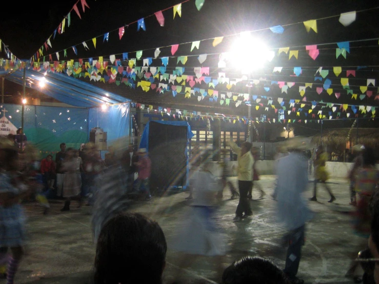 a number of people in a field with lights