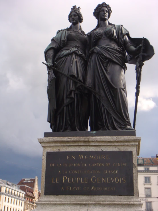 there are statues of two women with poles