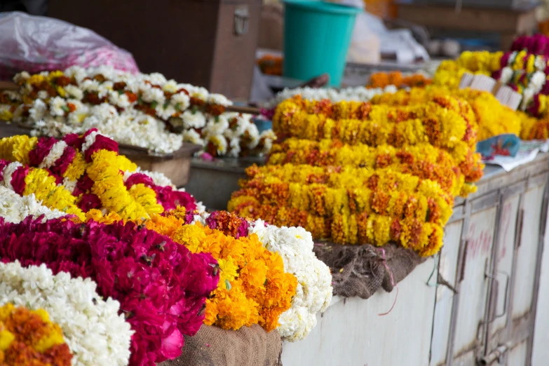 a bunch of flowers sitting on a table with other decorations