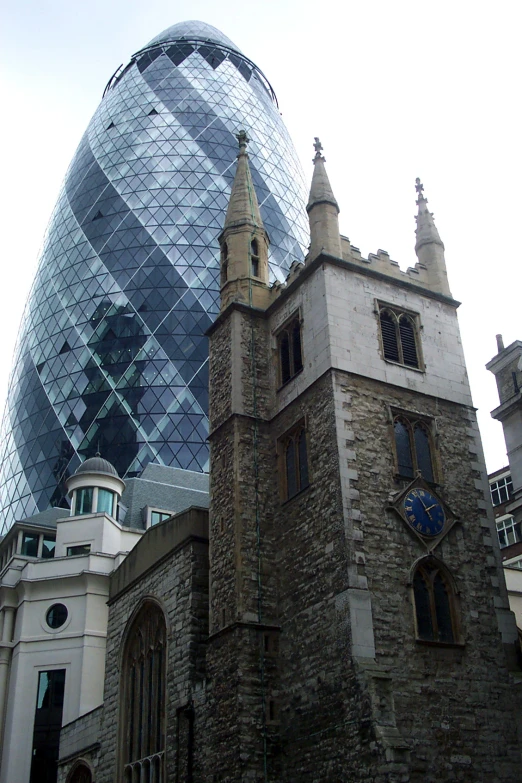 a large glass dome behind some old buildings