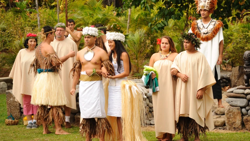 people in native clothing standing near each other