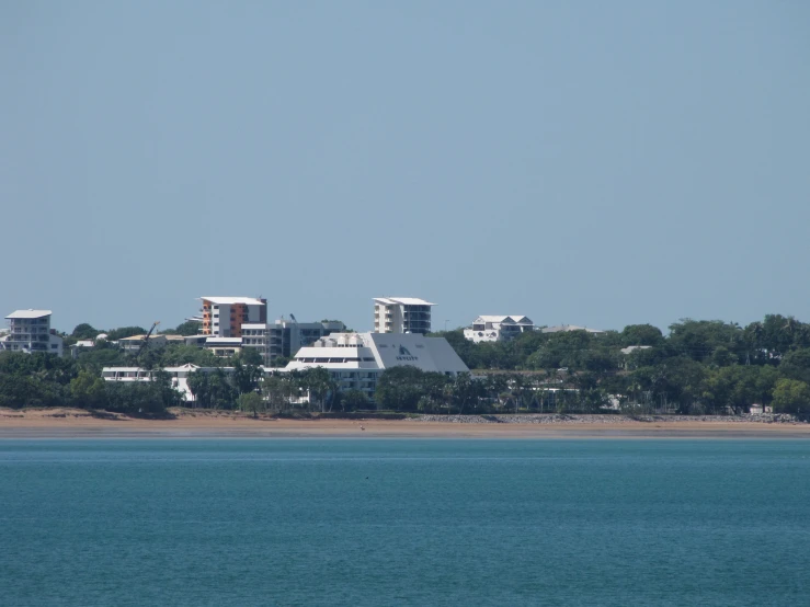 a large body of water that has some buildings near it