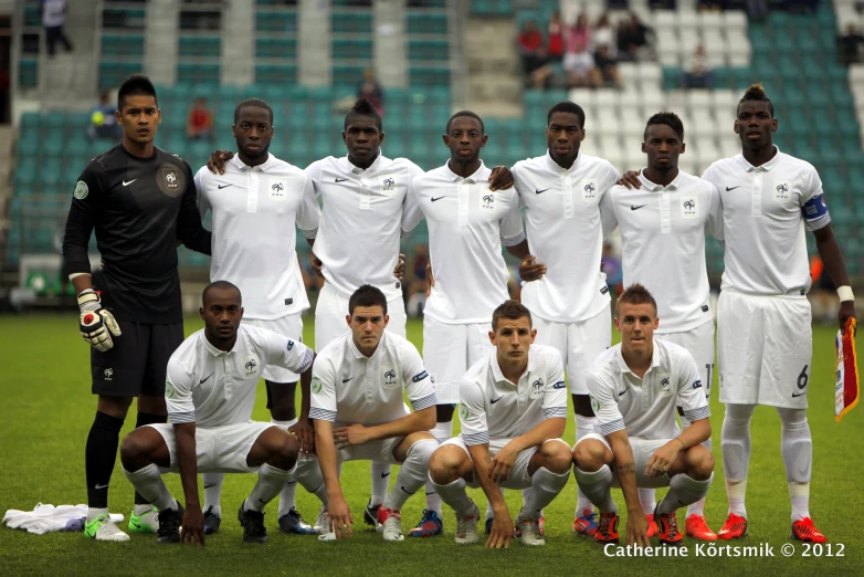 a soccer team is posed for a team pograph