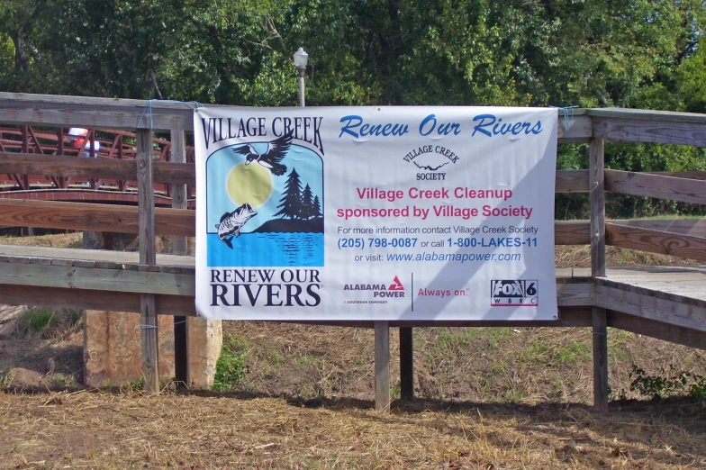 a sign advertising an old canoe event and the bridge