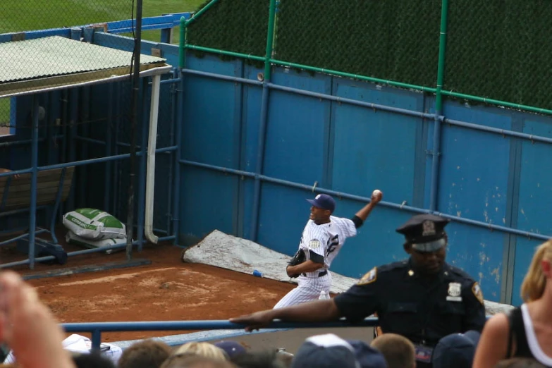 a baseball player winding up to throw the ball