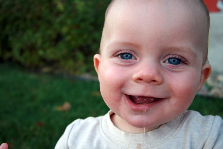 a close up of a child with a tooth brush