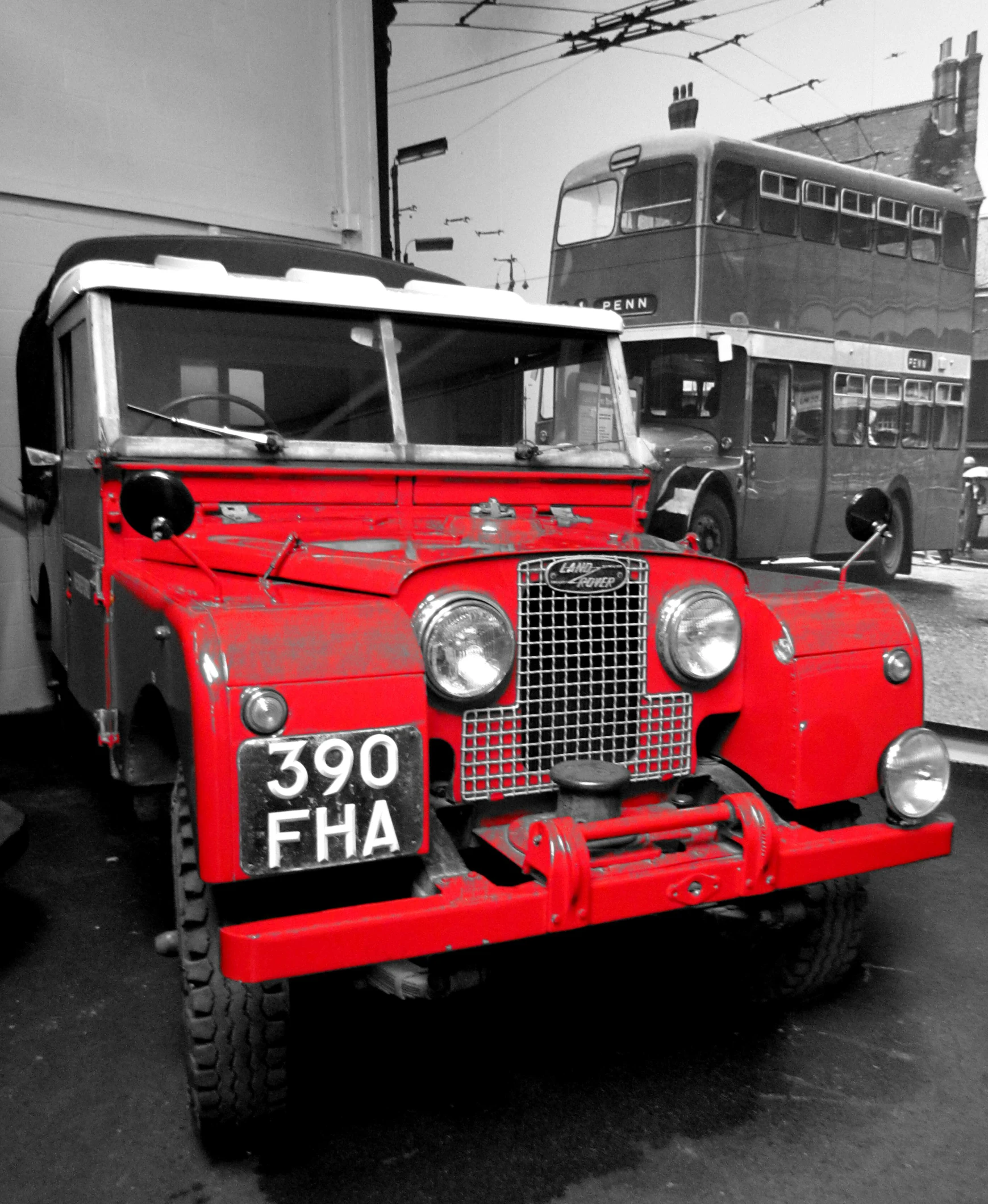 a red truck parked next to a double decker bus