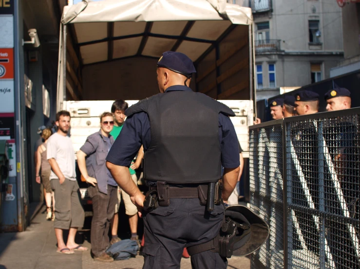 there are police officers walking along the street