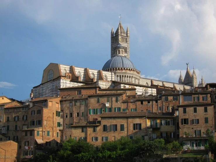 an architectural view of a large building and steeple