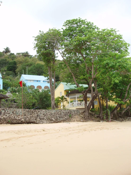 a group of buildings near the beach in a town