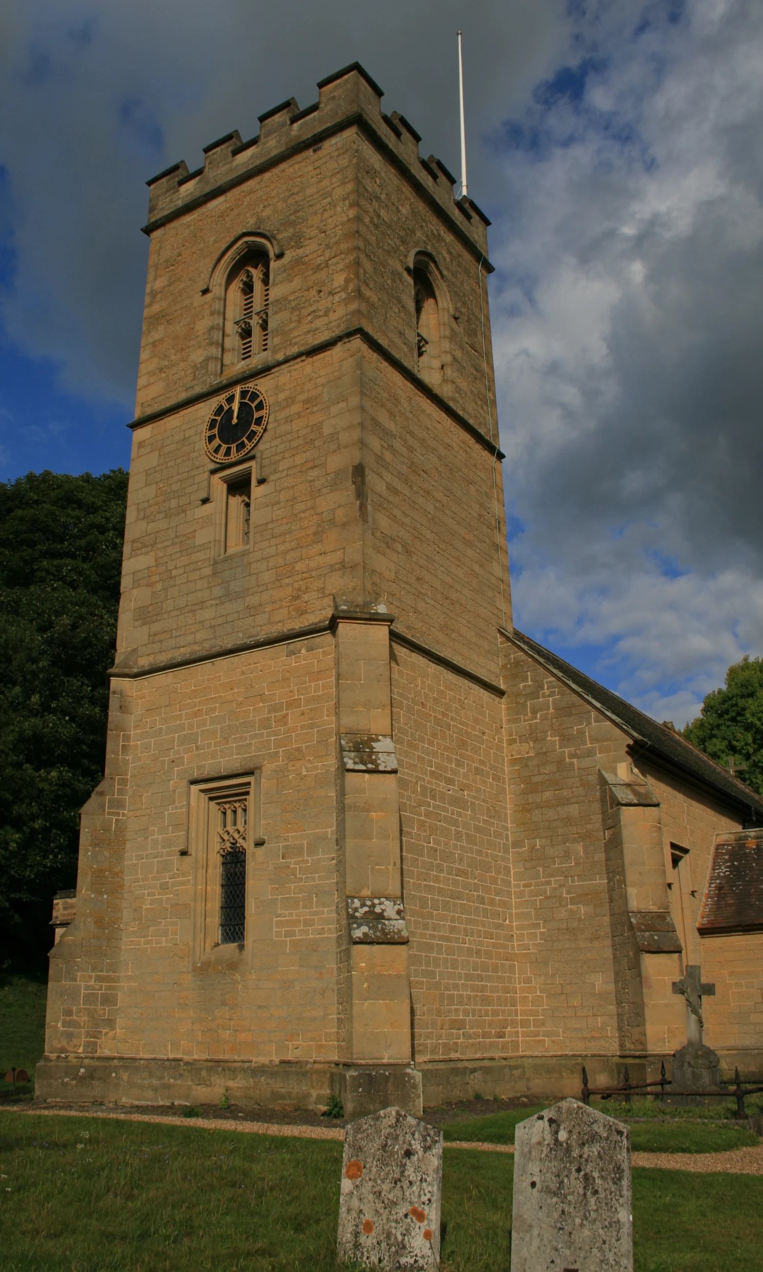 an old brick building with a large clock at the top