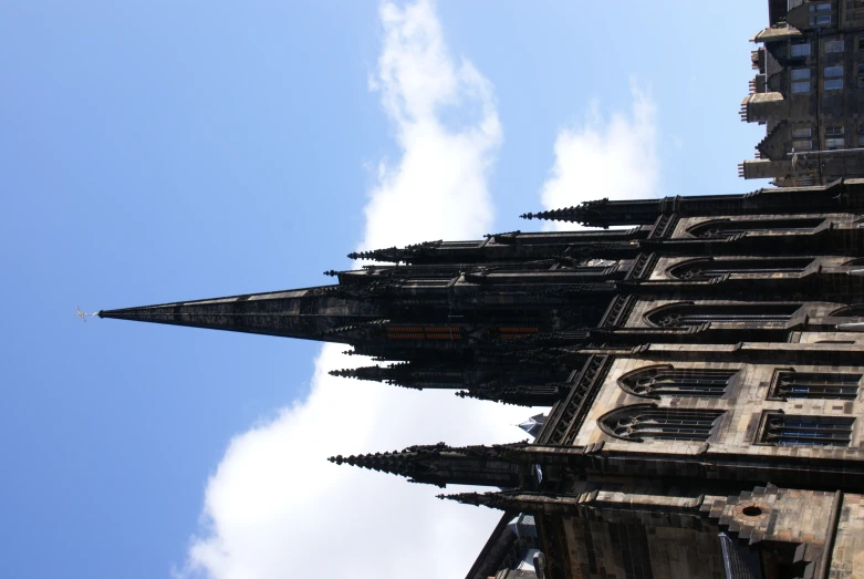 an image of a church steeple on a blue day