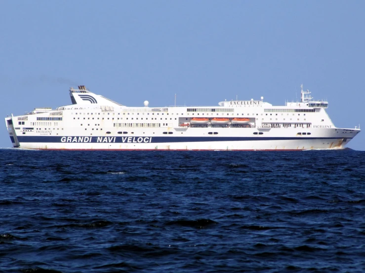 a cruise ship on the water and blue sky