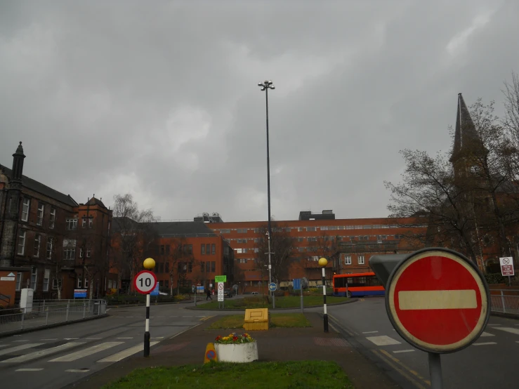 a sign with a street name and stop sign on the corner