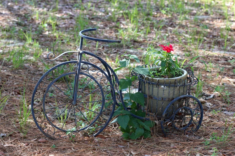 a bicycle is leaning up against a planter