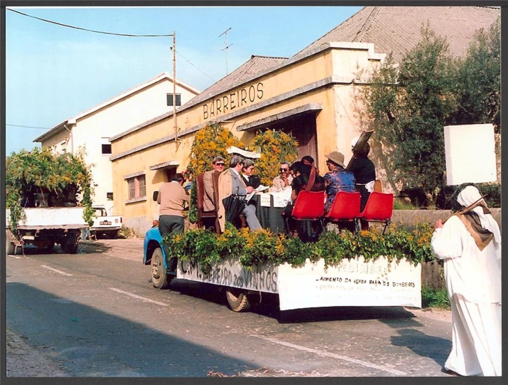 people standing in the back of a pickup truck