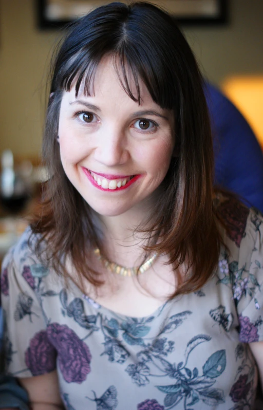 a woman with a nice smile looking into the camera