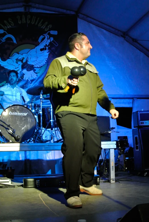 man holding a hair dryer in front of his face