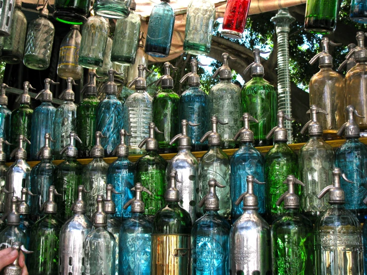 many large and small jars and water bottles