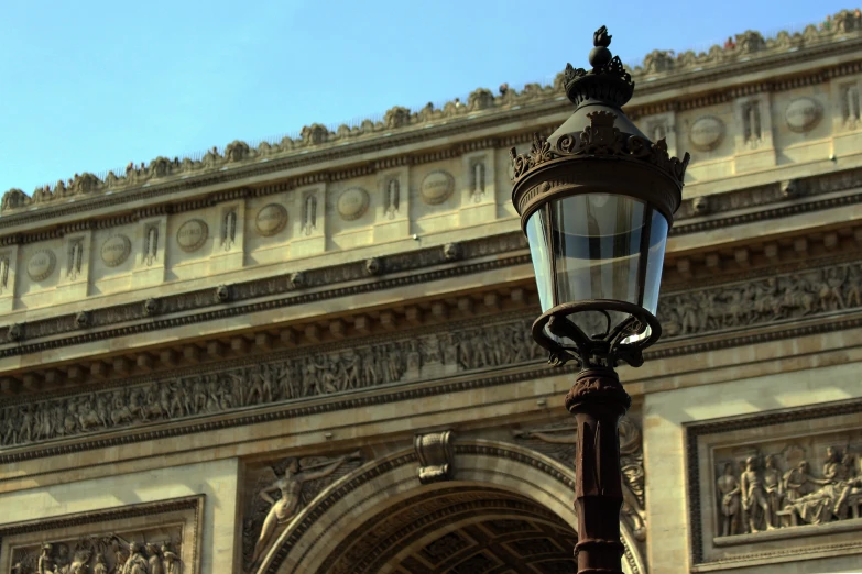 a picture of an iron and glass wall on top of a street light