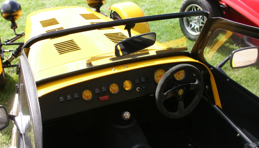 a close - up view of the steering wheel and the front of a small race car