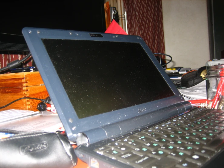 a black laptop sitting on top of a table