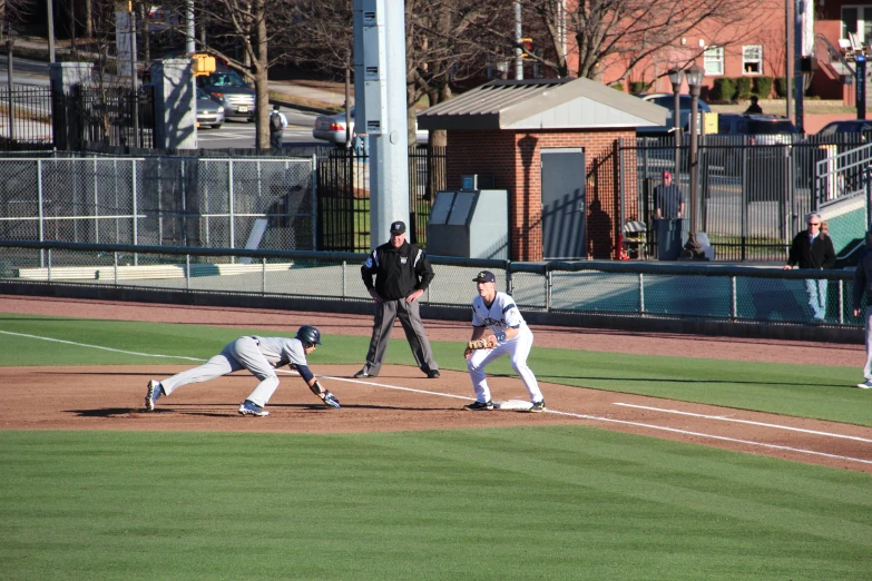 a baseball player is running while playing on the field