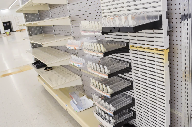 an empty store with shelves with some items on them