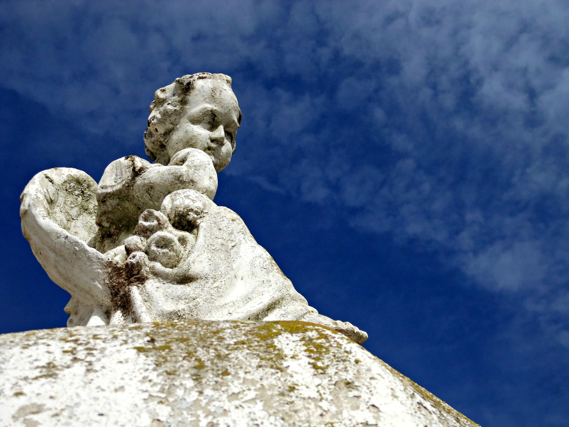 the head of a statue on a building in the air