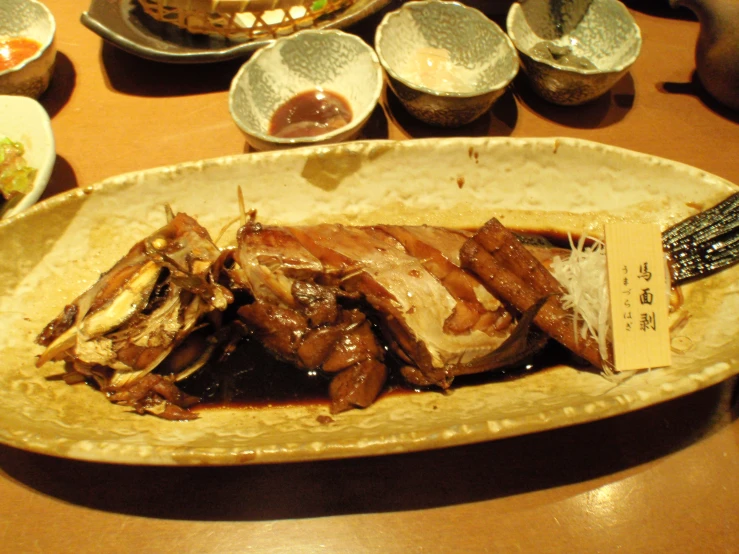 a plate of cooked meat on a table