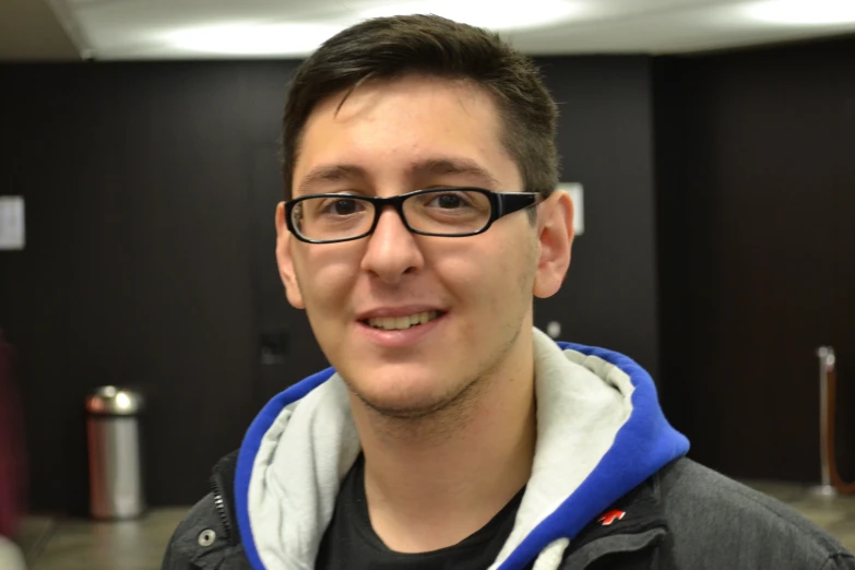 a man standing in an elevator with his eyes closed