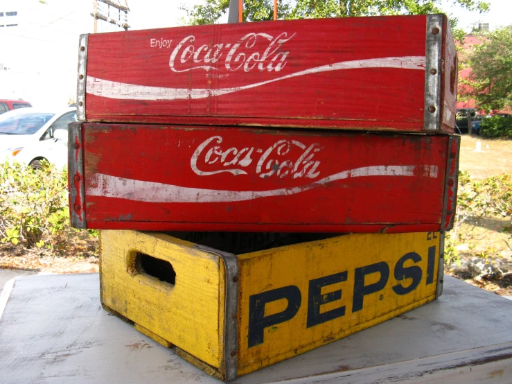 coca - cola boxes on display at outdoor park