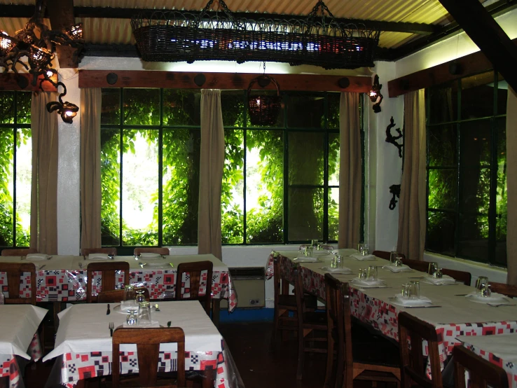 a dining area that is decorated in red and white