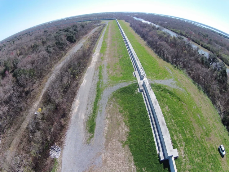 an aerial view of two lanes of a large highway through the countryside