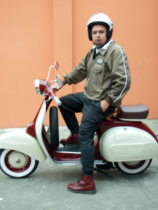 a man poses with his motorcycle