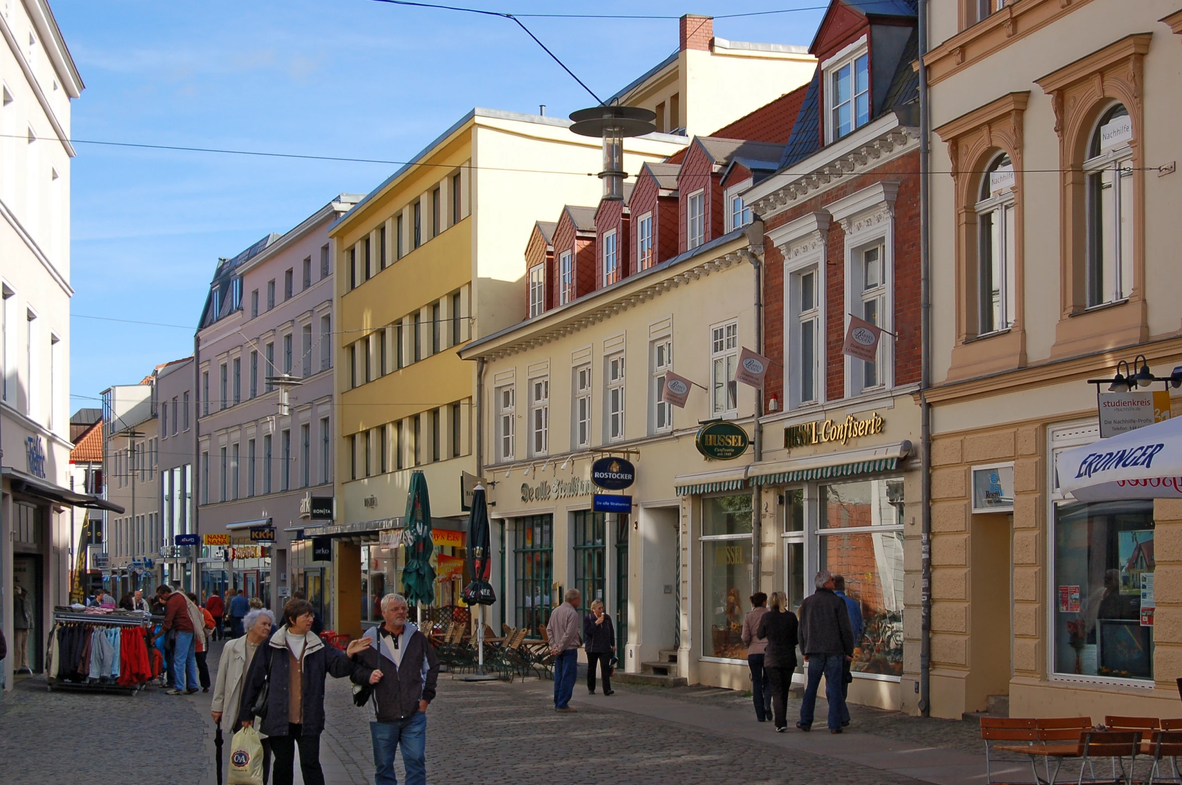 a street lined with lots of different colored buildings