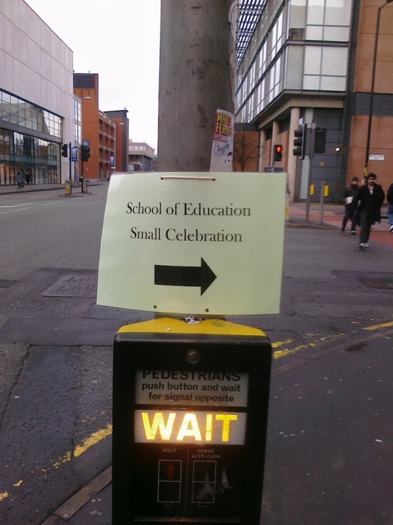 a sign that says, school of education small celetion