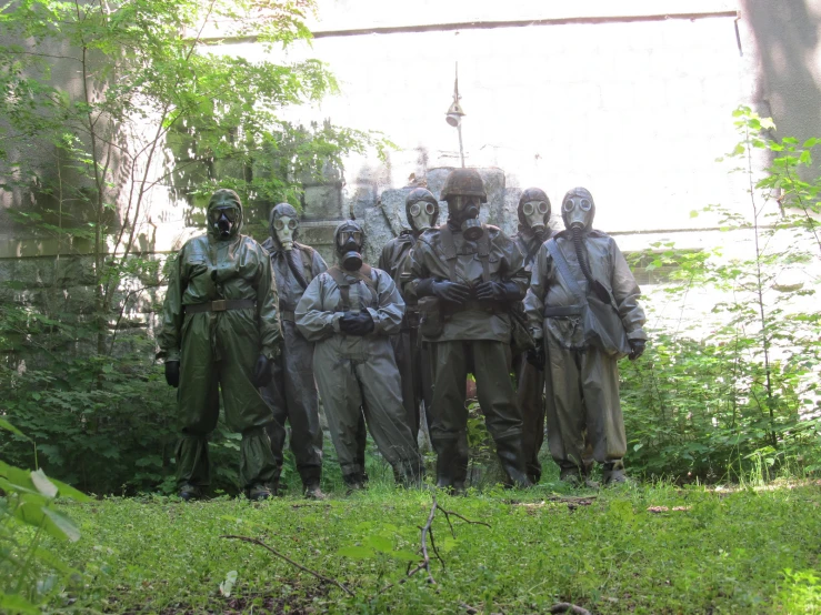 a group of soldiers is standing in front of some statues