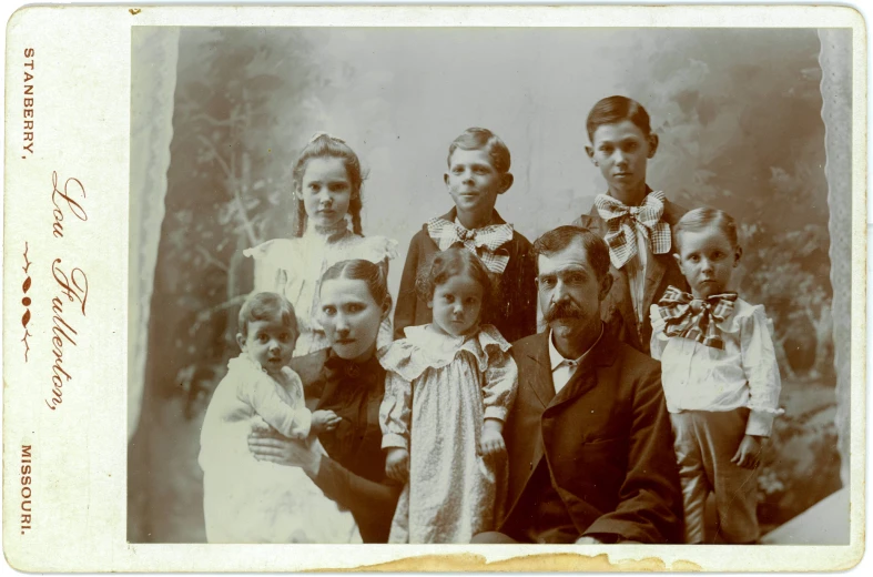 an old picture of people and a child