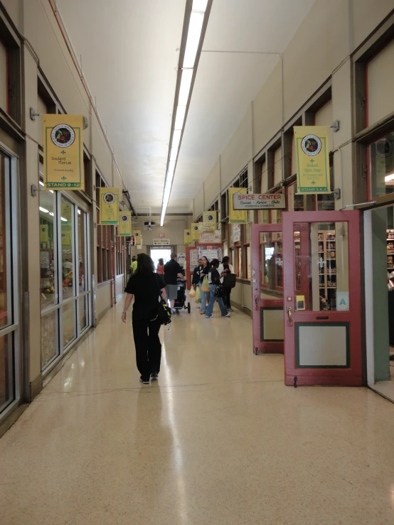 people are walking through the store's doors to their customers