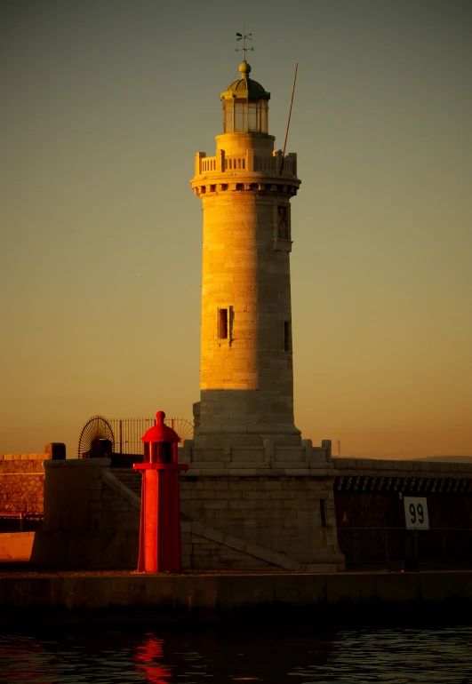 a building stands next to a small tower