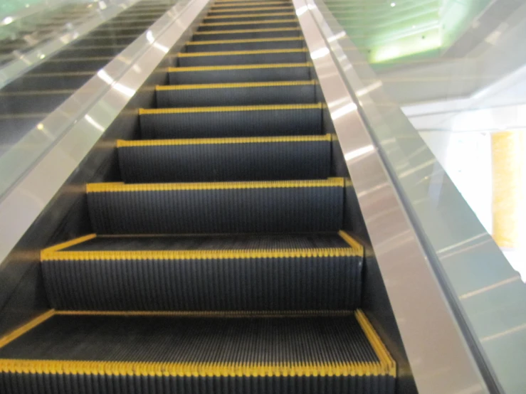 a bunch of stairs with a yellow line down them