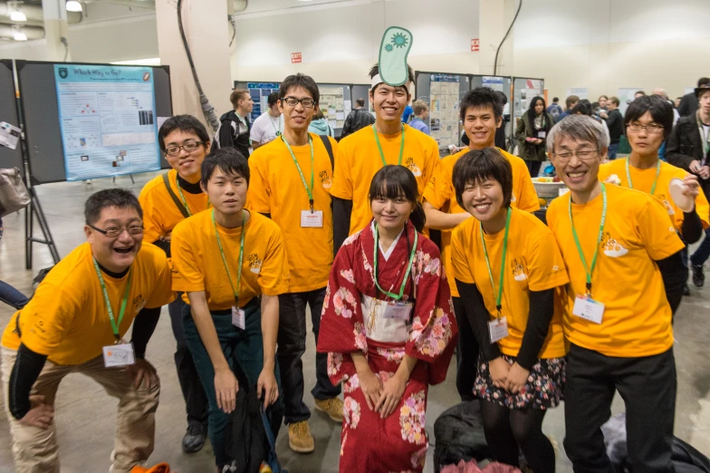 many asian people are standing together and posing for a po