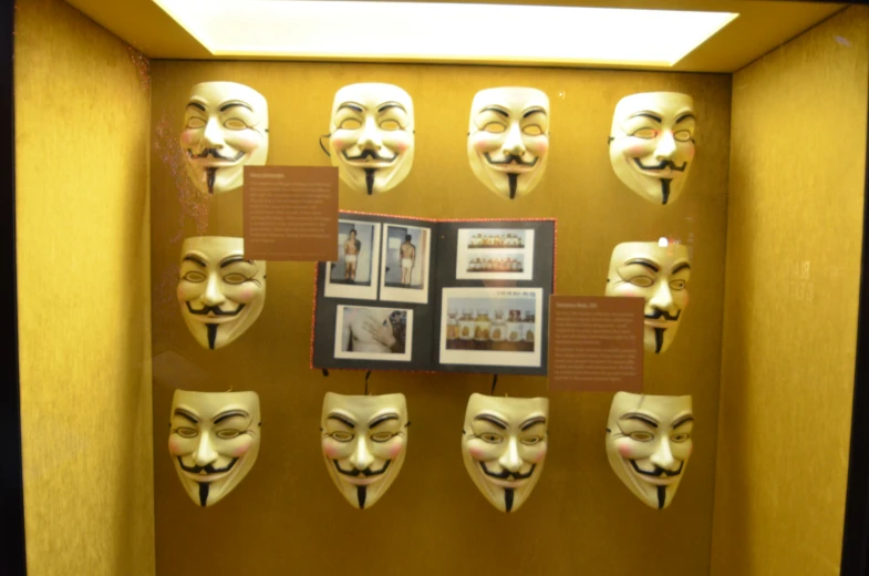 a display case in a store front showing many different masks